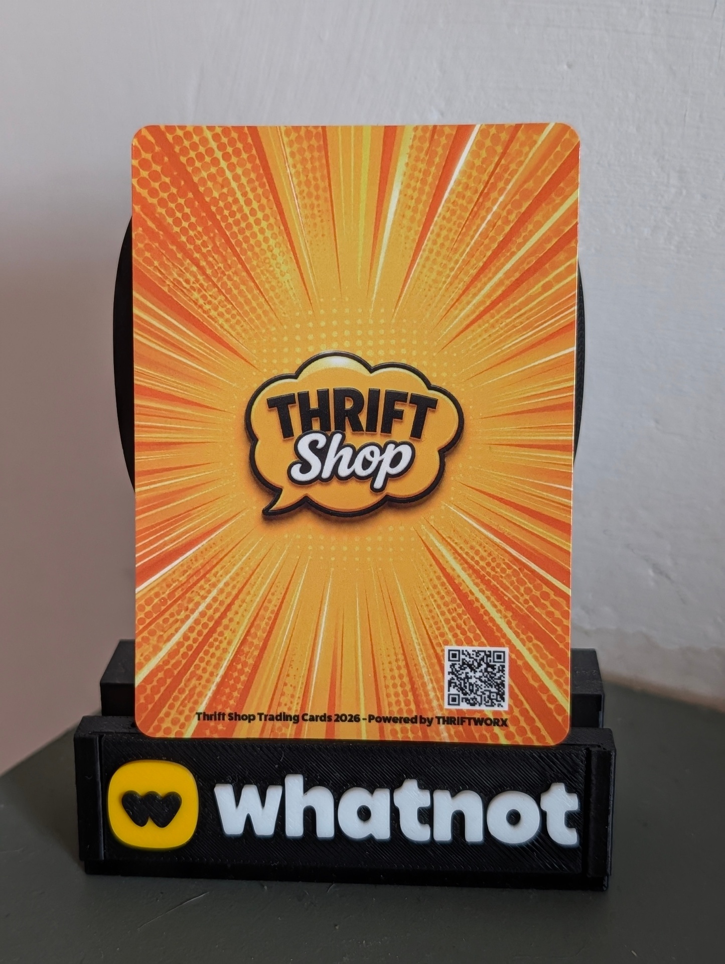 The 2026 back — same yellow burst, tighter composition, QR code in the corner.